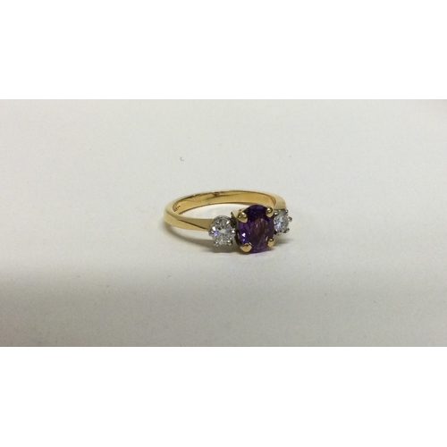 897 - A fine quality amethyst (approx. 1.3 carats),and diamond (approx. 0.2 carats), three stone ring in 1... 