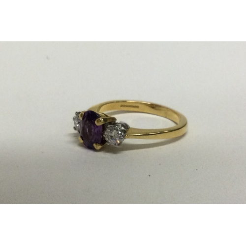 897 - A fine quality amethyst (approx. 1.3 carats),and diamond (approx. 0.2 carats), three stone ring in 1... 