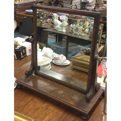 110 - A good mahogany swing handled mirror. Est. £20 - £30.