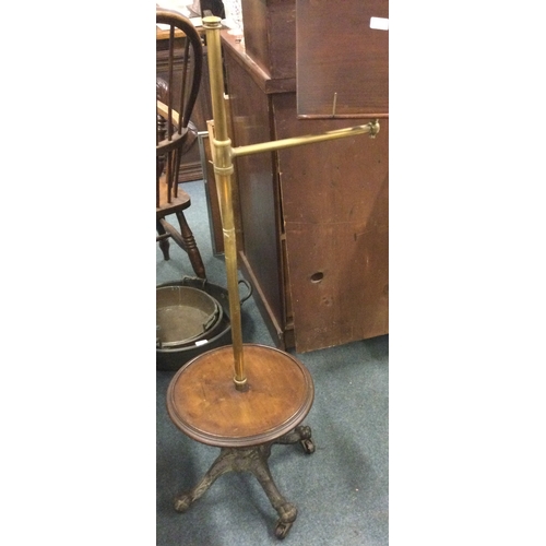 114 - A good quality brass mounted music stand. Est. £60 - £80.