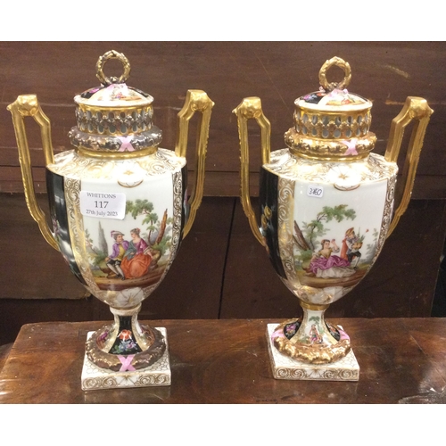 117 - A pair of attractive Continental vases on stands. Est. £30 - £60.