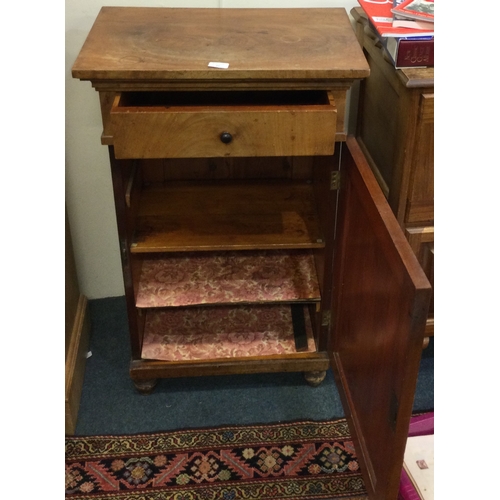 16 - A Continental single drawer cupboard. Est. £40 - £50.