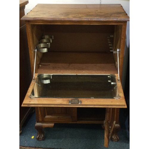 17 - A Continental drop flap cupboard. Est. £20 - £30.