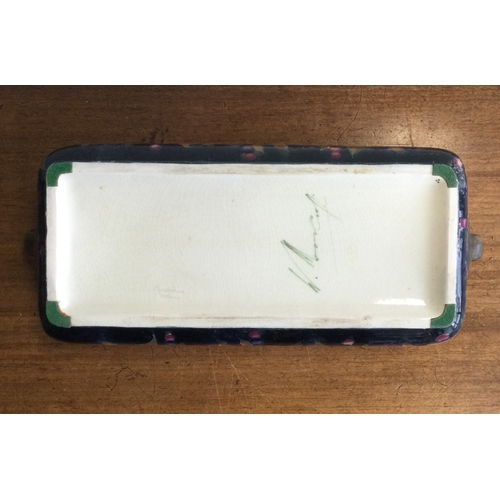 247 - WILLIAM MOOCROFT: A rectangular twin handled trough on green background of pomegranate design. 1913 ... 