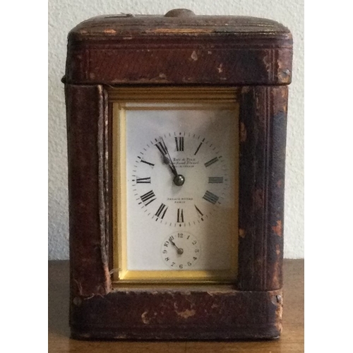 251 - A good French carriage clock with white enamel dial. By Le Roy. Est. £150 - £200.