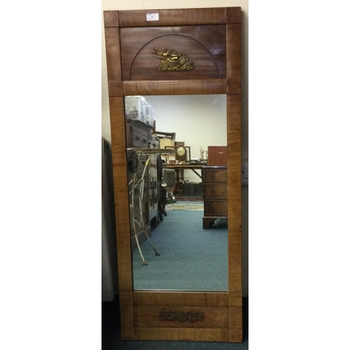 46 - A Continental brass mounted mirror. Est. £30 - £40.