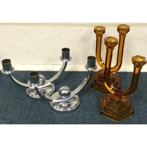 50 - A pair of stylish chrome candlesticks etc. Est. £30 - £50.