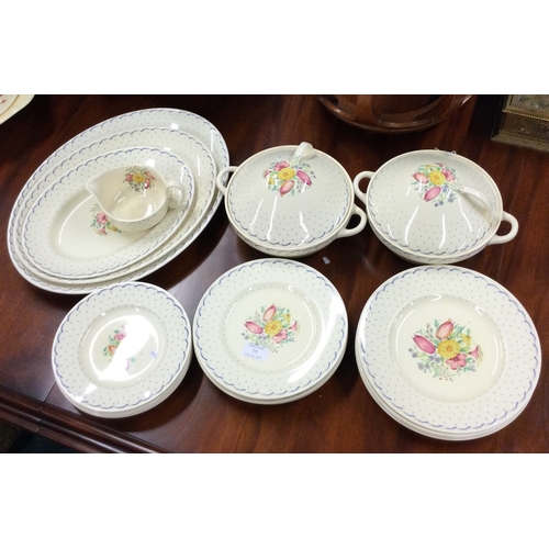 73 - An extensive Susie Cooper dinner service of typical form. Est. £80 - £120.