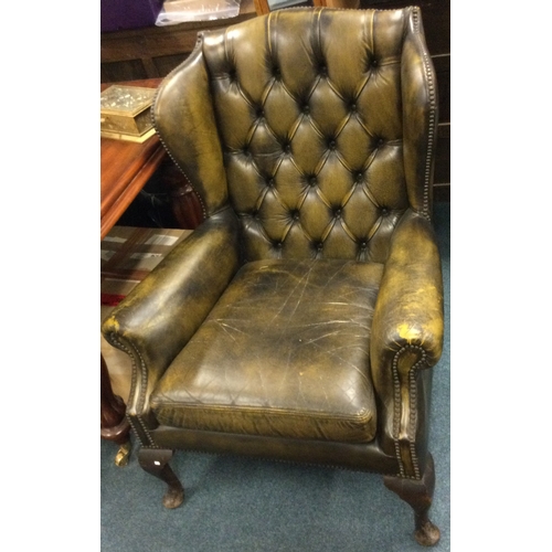 79 - A good leather button back smokers chair. Est. £40 - £60.