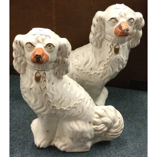 95 - A pair of Staffordshire dogs. Est. £20 - £30.