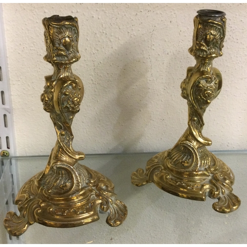 47 - A pair of brass candlesticks. Est. £50 - £80.