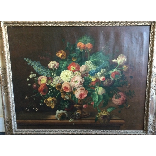 1032 - An oversized gilt framed canvas painting depicting still life with flowers. Apparently unsigned. App... 