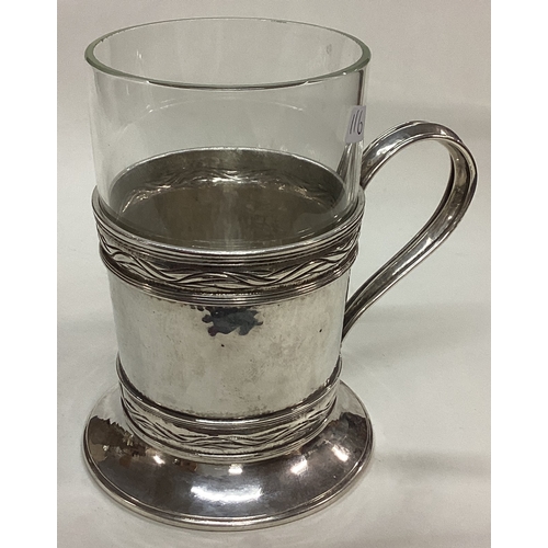 116 - OMAR RAMSDEN: A fine silver mounted glass tea holder. London 1930. Approx. 272 grams of gross weight... 