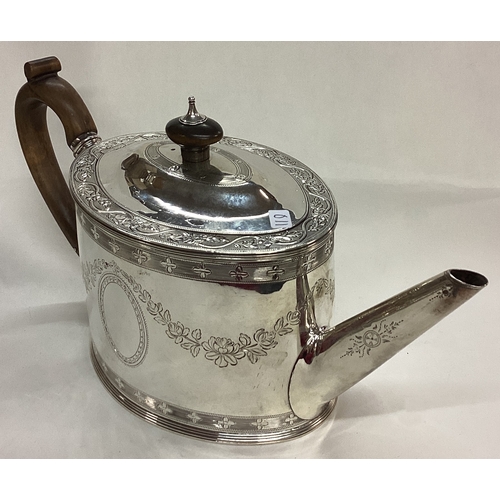 119 - An 18th Century George III bright-cut silver teapot. London 1786. By Charles Aldridge. Approx. 436 g... 