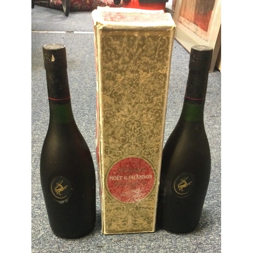 1249 - Two bottles of Rémy Martin Cognac (both unlabelled but emblems and seals present), together with a b... 