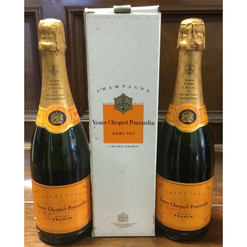 1251 - Two bottles of Veuve Cliquot Ponsardin Brut Champagne together with a similar boxed bottle. (3). Est... 