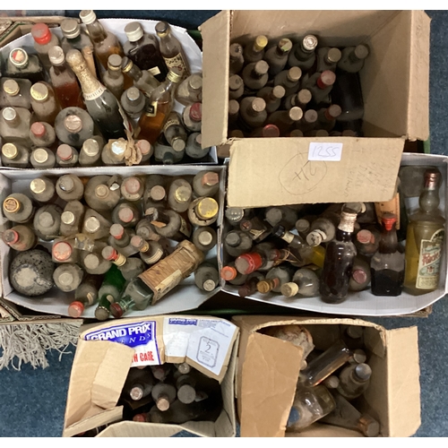 1255 - A box containing various miniature bottles of spirits etc. Est. £20 - £30.