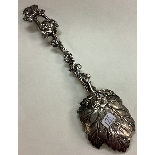 126 - A fine Victorian silver serving spoon with grape vine decoration. 1861. By George Angel. Approx. 77 ... 