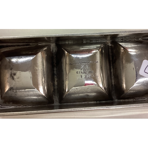 127 - An early 20th Century large American silver triple stamp case. Marked to base. Approx. 90 grams. Est... 