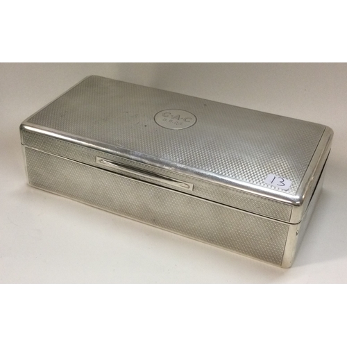 13 - A heavy engine turned silver cigar box. London 1922. By Mappin & Webb. Approx. 487 grams of gross we... 