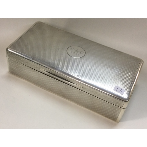 13 - A heavy engine turned silver cigar box. London 1922. By Mappin & Webb. Approx. 487 grams of gross we... 