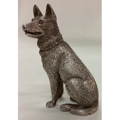 130 - A fine cast silver figure of a German Shepherd. Approx. 234 grams. Est. £300 - £500.