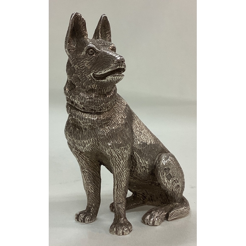 130 - A fine cast silver figure of a German Shepherd. Approx. 234 grams. Est. £300 - £500.