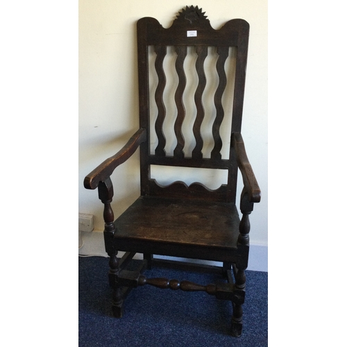 1301 - An Antique oak hall chair on turned supports. Est. £30 - £50.