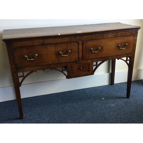 1311 - A good early oak three drawer sideboard with brass handles. Est. £150 - £200.