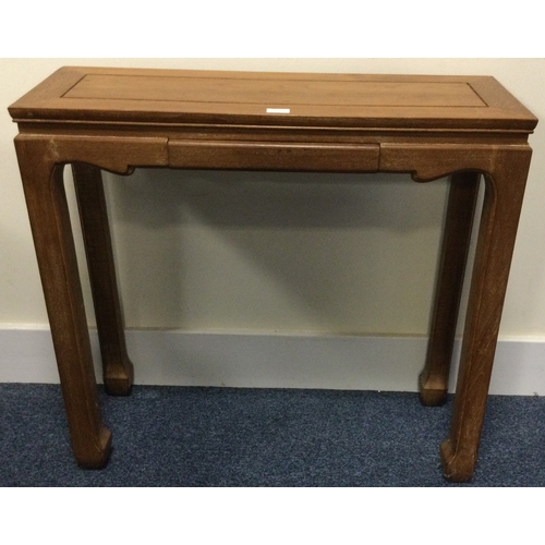 1326 - An Eastern single drawer hall table of typical form. Est. £30 - £50.