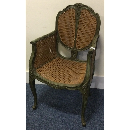 1327 - A good Continental hall chair with cane decoration. Est. £50 - £80.