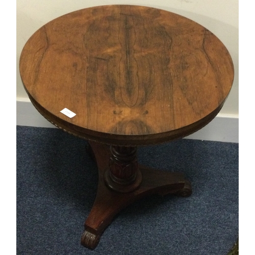 1329 - A good quality rosewood single pedestal table on sweeping supports. Est. £50 - £80.