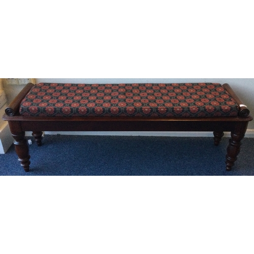 1334 - A mahogany hall bench with scroll decoration. Est. £100 - £150.