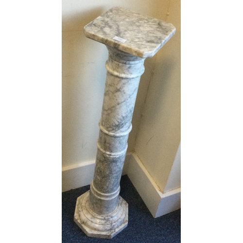 1342 - A good quality tapering marble pedestal of shaped form. Est. £100 - £150.