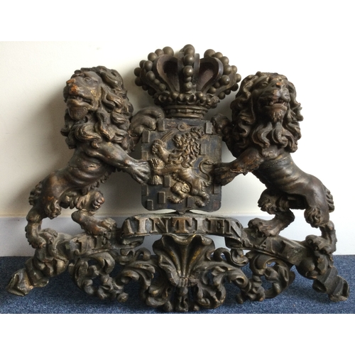 1345 - A large carved wooden coat of arms with crown finial and scroll decoration and crested centre. Est £... 