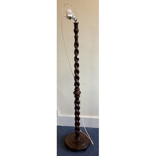 1349 - An oak barley twist standard lamp. Est. £30 - £50.