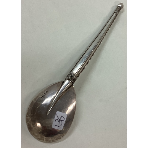 136 - An Arts & Crafts Artificers Guild silver spoon. London 1924. Approx. 37 grams. Est. £200 - £300.