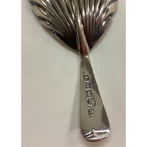 15 - EXETER: A Georgian silver fluted caddy spoon. 1832. By Isaac Parkin. Approx. 12 grams. Est. £50 - £8... 