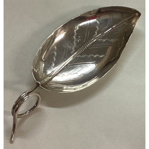 16 - A Georgian bright-cut silver caddy spoon with leaf pattern. Birmingham 1800. By Joseph Angel. Approx... 