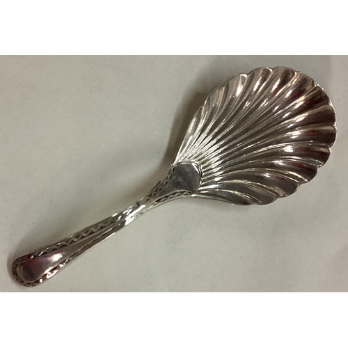 17 - An 18th Century Georgian silver fluted caddy spoon. Sheffield 1786. By John Younge & Co. Approx. 11 ... 