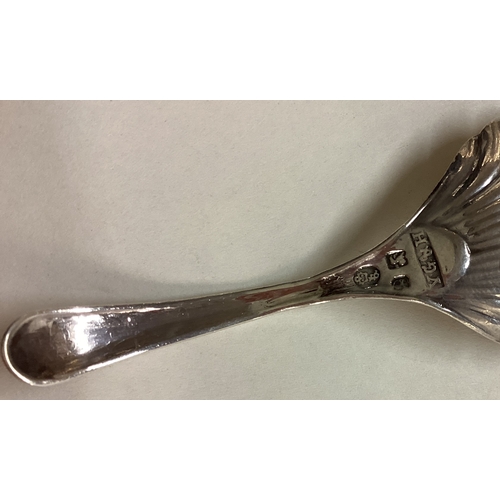 17 - An 18th Century Georgian silver fluted caddy spoon. Sheffield 1786. By John Younge & Co. Approx. 11 ... 