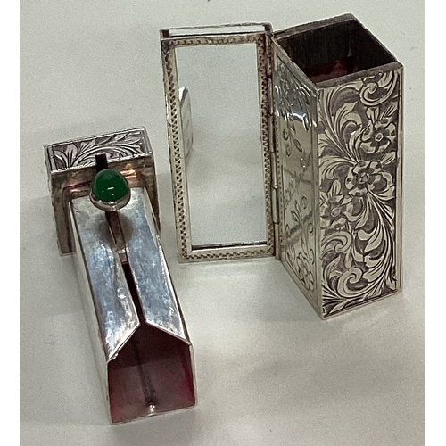 185 - A heavy engraved silver and gemstone lipstick holder. Approx. 45 grams. Est. £40 - £60.