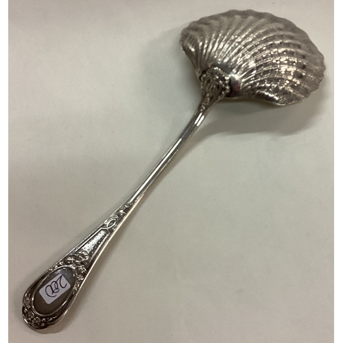 200 - An ornate 19th Century French silver serving spoon. Approx. 73 grams. £60 - £80.