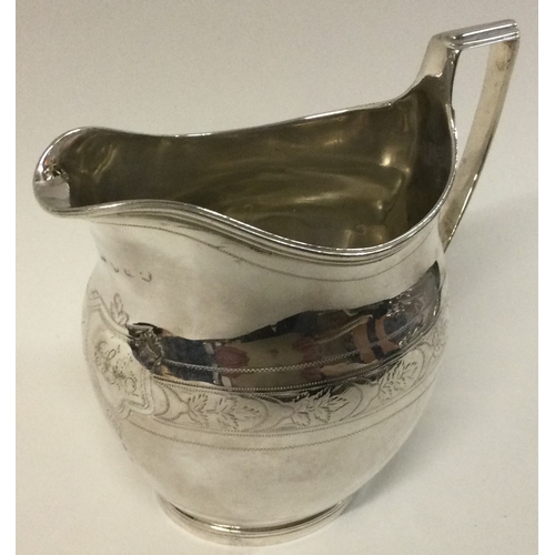 207 - A George III silver bright-cut jug. London 1803. Approx. 77 grams. Est. £50 - £80.