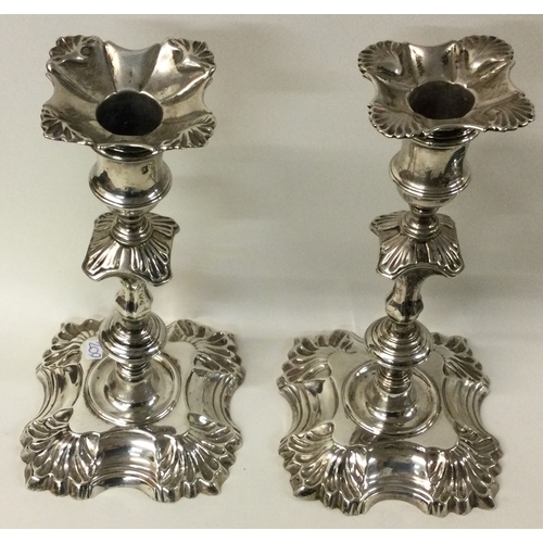 209 - A fine pair of 18th Century George II cast silver candlesticks with shell border. London 1747. By FS... 