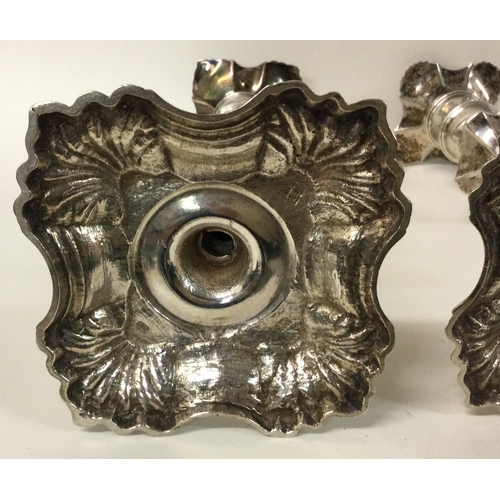 209 - A fine pair of 18th Century George II cast silver candlesticks with shell border. London 1747. By FS... 