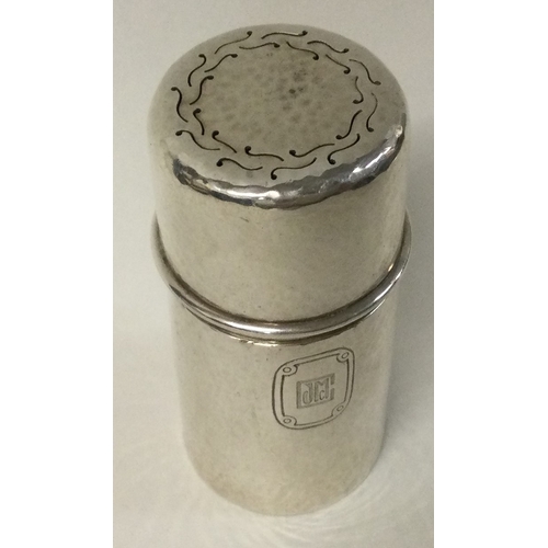 219 - TIFFANY & CO: A hammered silver perfume holder. Marked to base. Approx. 77 grams. Est. £100 - £150.