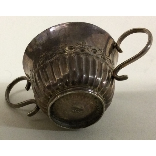 228 - An 18th Century Provincial silver porringer. Makers mark only. Marked to base. Approx. 24 grams. Est... 