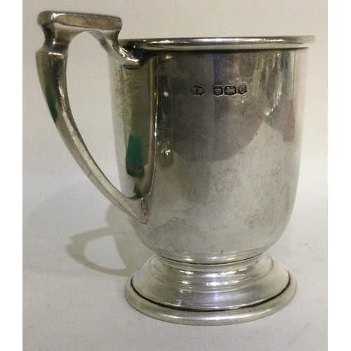 238 - A heavy tapering silver christening mug. Sheffield. Approx. 152 grams. Est. £50 - £80.