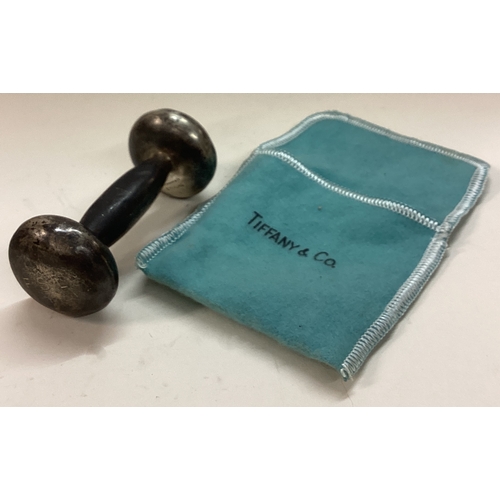 243 - TIFFANY & CO: A silver rattle in original sleeve. Approx. 40 grams. Est. £40 - £60.